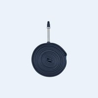 Image of a compactly rolled-up Corsino bike tube FV48mm, size 700x23/25C. The tube is black, made from rubber, and features a 48mm valve.