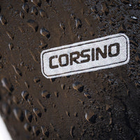 Close-up macro shot of the premium waterproof polyester fabric on the Corsino Jaunt bike bag. Engineered to actively repel road spray and sudden rain showers, keeping your delicate electronics and repair tools completely dry.