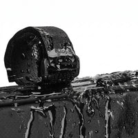 Close-up demonstrating the water-resistant premium polyester material of the Corsino Shortcut bike frame bag repelling heavy water droplets to protect your cycling gear from the elements