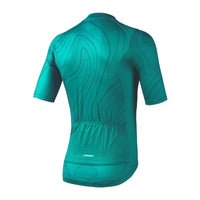 Rear profile of the teal Venice women's jersey, displaying the traditional sleeve elastic finish, 3 bag pockets, and integrated highly visible reflective safety bands.