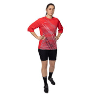 Female cyclist wearing the red Corsino Lines downhill jersey, demonstrating how the Quick Dry fabric seamlessly contours to a rider's movements while the overlap collar ensures all-day comfort on long enduro rides