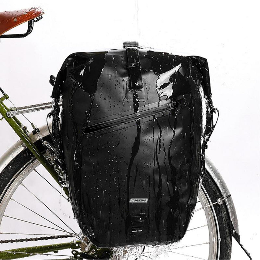 Black Corsino Journey Pannier Bag 27L mounted on a bike rack, showcasing its sleek waterproof design and large storage capacity for cycling trips. Made of waterproof 500D PVC Twill Fabric. Dimensions: 29x15.5x45/65cm, weight: 1100g.