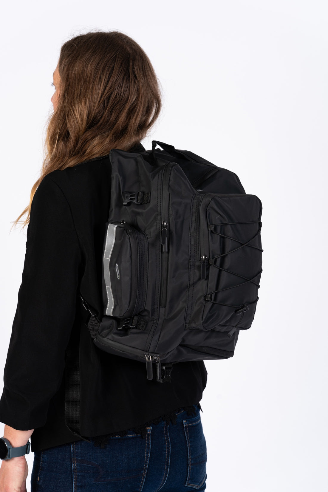 Corsino Pannier Bag 75L in black, made from water-resistant 500D PVC Twill Fabric, shown being used as a backpack with shoulder straps.
