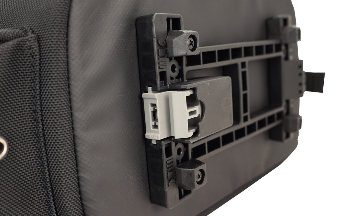 Close-up of the MIK 2.0 system anti-theft lock on the bottom of the Corsino Adventure 12L trunk bag, ensuring your cycling gear stays safe when parked