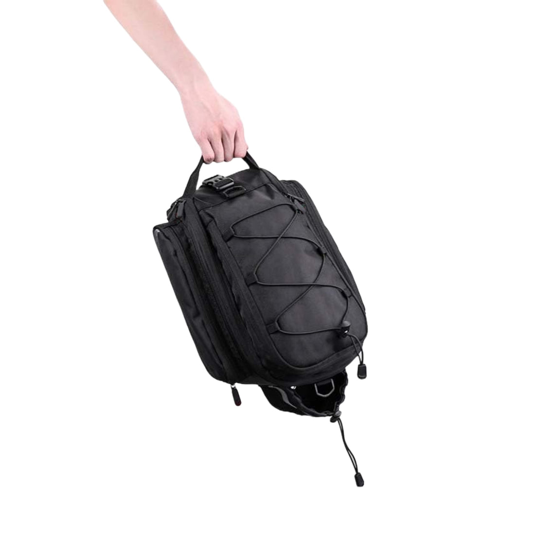 Hand holding the black Corsino Adventure 12L portable bike cargo bag by its top handle, highlighting the rugged 32x18x21cm construction and convenient off-bike transport