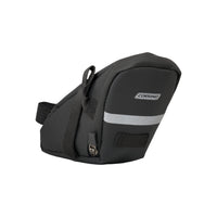 Side profile of the streamlined Corsino Jaunt Saddle Bag. Crafted from durable, water-resistant polyester, this compact under-seat pouch provides essential flat-tire tool storage without adding unnecessary weight or bulk to your bike.