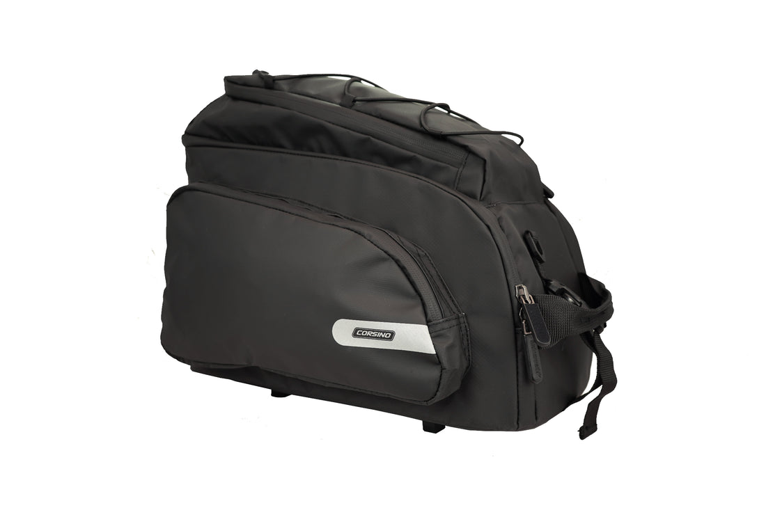 Side profile of the black Corsino Quest 17L bike rear rack bag, a spacious and robust PVC cargo solution designed for daily bicycle commuting and organized gear transport