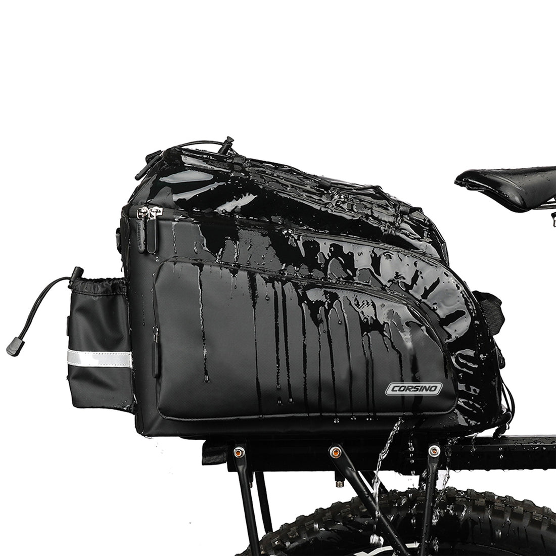 Water resistant Corsino Quest 17L bike trunk bag repelling heavy water while mounted on a rear rack, demonstrating its durable PVC construction and all-weather protection