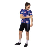 Model showing front of the premium Corsino Florazzo women's cycling jersey. Highlighting the secure internal silicone waistband gripper that ensures the aerodynamic, cooling fabric stays locked perfectly in place during aggressive road climbs and fast descents