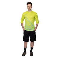 Action-ready rider sporting the vibrant yellow Corsino Lines 3/4 sleeve off-road jersey. The functional comfort fit combined with premium moisture-wicking technology ensures peak athletic performance and maximum visibility when shredding deep forest trails.