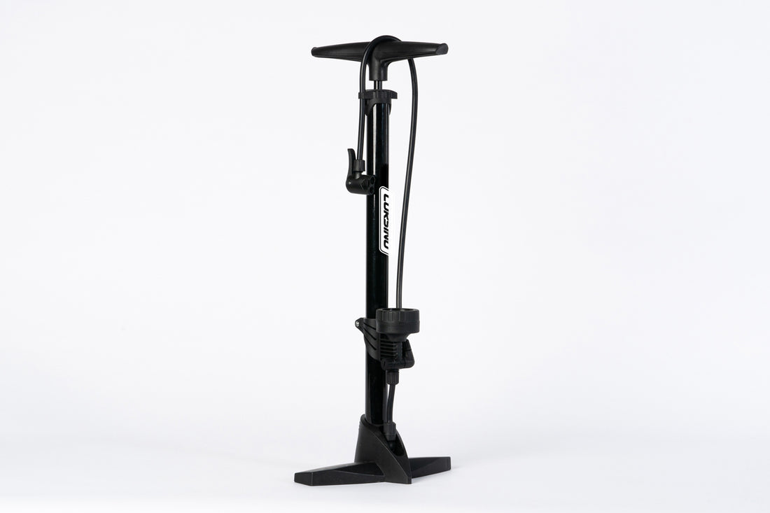Full view of the heavy-duty Corsino Cycling Floor Pump in a sleek black finish. Crafted from robust alloy steel, this high-performance tire inflator easily delivers a massive 160 PSI, providing road cyclists with a stable, highly efficient inflation base before every ride.