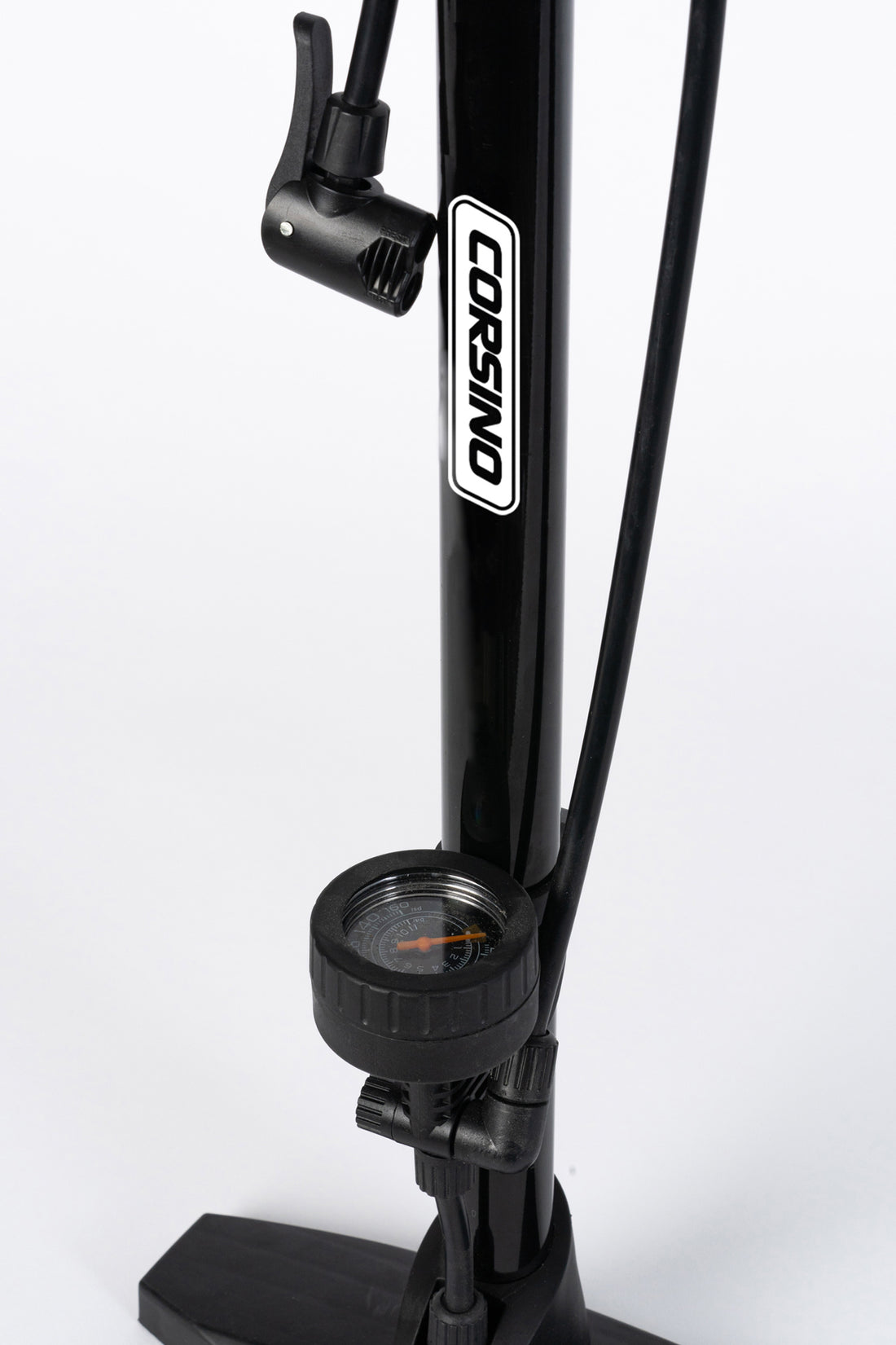Close-up of the Corsino bike floor pump's highly versatile dual-compatible head. Engineered to seamlessly lock onto both Presta and Schrader valves, ensuring an airtight, effortless tire inflation process for any road or mountain bike setup.